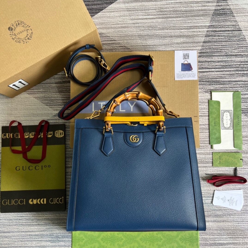 G*u*i top handle bags